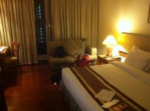 Bandara Suites Silom bedroom with sofa and tv