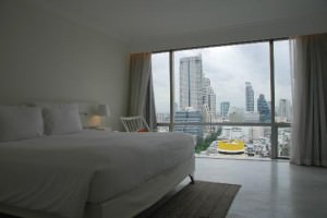 Pullman Bangkok Hotel G big bed with view of silom