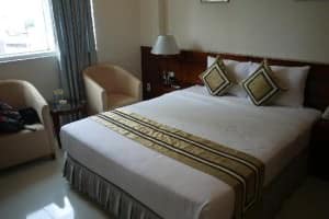 White Lotus Hotel HCMC bed corner and chairs