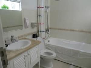 Calypso Grand Hotel toilet with bath shower combo