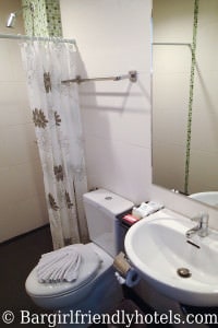 The Chambre Patong bathroom with sink and shower in back