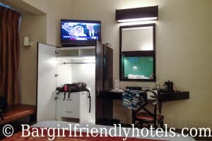 Room amenities at the Microtel by Wyndham Boracay witrh TV, desk and wardrobe