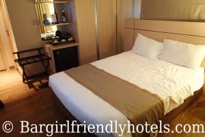 Queen size Bed inside superior room of Petals Inn hotel Bangkok