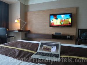 Flatscreen Samsung TV and desk seen from bed at DoubleTree by Hilton Bangkok Ploenchit