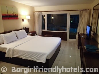 Executive Nouveau room at Baywalk Residence with Balcony at night