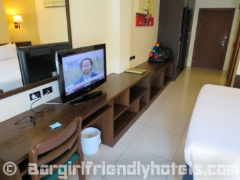 LCD TV and desk area at Executive Nouveau room inside Baywalk Residence