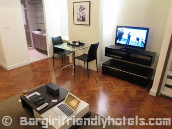 Living room and dining table inside Phachara Suites Sukhumvit Studios_