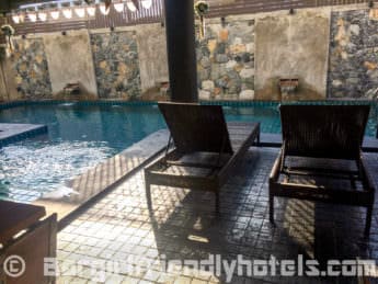 Loungers around the Thapae Loft Hotel pool