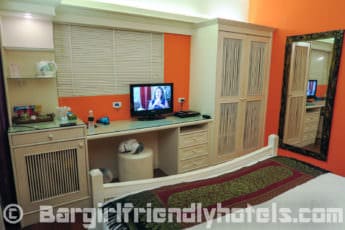 deluxe-room-furnishings-with-flat-screen-tv-at-center-at-royal-phawadee-village-patong-beach-hotel_