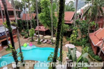 lovely-pool-area-surrounded-by-tropical-garden-inside-royal-phawadee-village-patong-beach-hotel