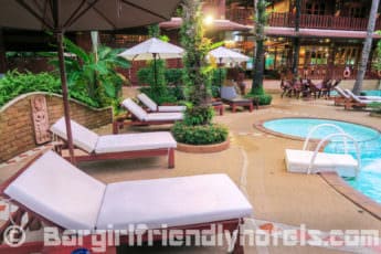 plenty-of-sun-loungers-around-rhe-pool-at-the-royal-phawadee-village-patong-beach-hotel