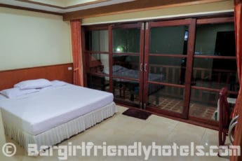 Deluxe rooms are basic with big window overlooking balcony at Alina Grande Koh Chang