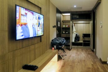 The new modern Deluxe rooms have a flatscreen TV and good storage space in Arte Hotel Bangkok