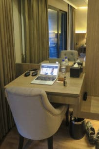 Small work desk area in room corner at Arte Hotel Bangkok with good wifi connectivity